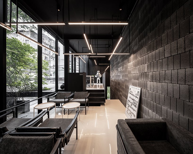 black timber clads IDIN architects' tranquil office space in bangkok